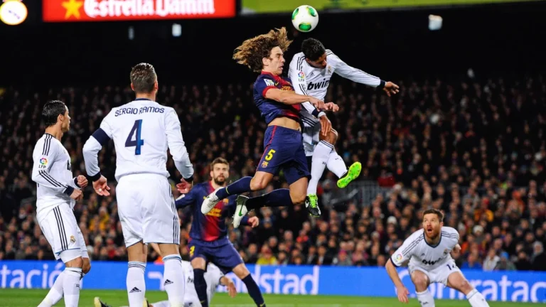 laliga matchday 10 el clasico - Real Madrid and Barcelona contest a header in El Clasico